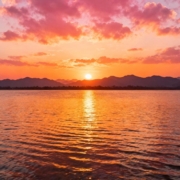 A boat sailing off the coast of Mallorca at sunset over the Mediterranean Sea.